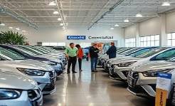 Connecticut dealers, welcoming, discussing vehicle options, photorealistic, spacious dealership with sleek vehicles lined up in rows, highly detailed, people interacting and browsing, 50mm lens, neutral tones, soft diffused lighting, shot with a zoom lens.